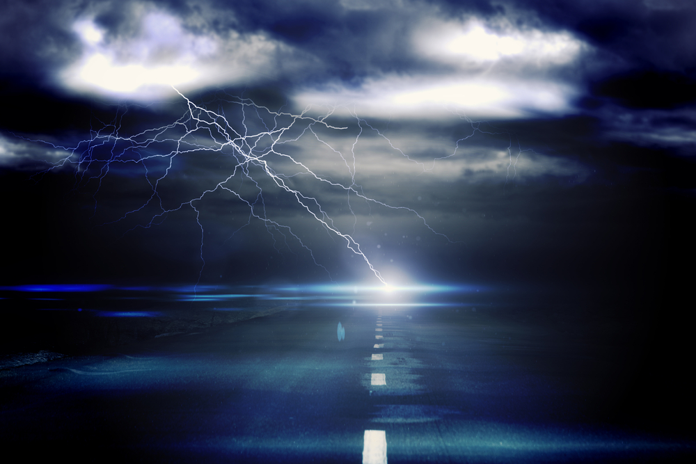 Digitally generated stormy sky over road with lightning